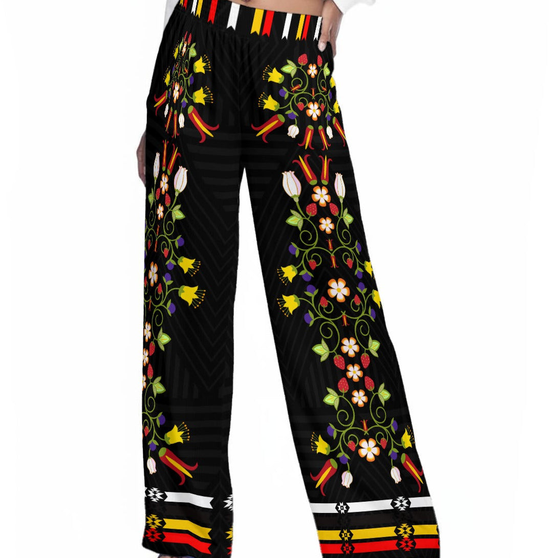 Black pants with colorful floral patterns on a white background