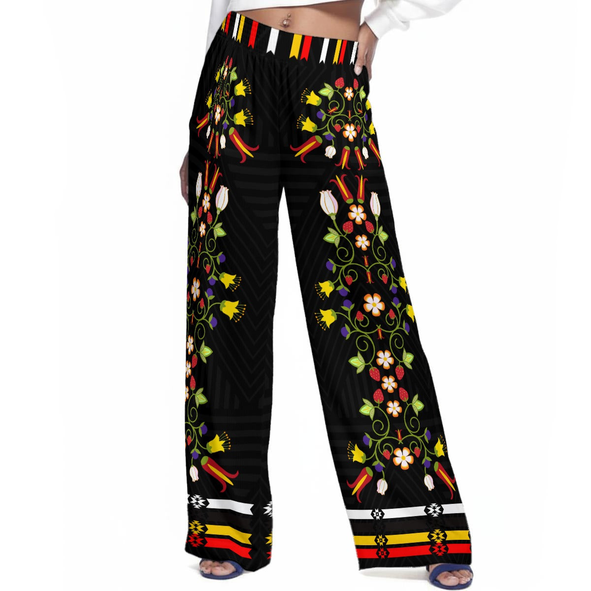 Black pants with colorful floral patterns on a white background
